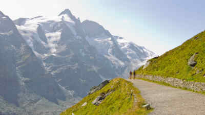 Hikers on a path in front of the Grossglockner